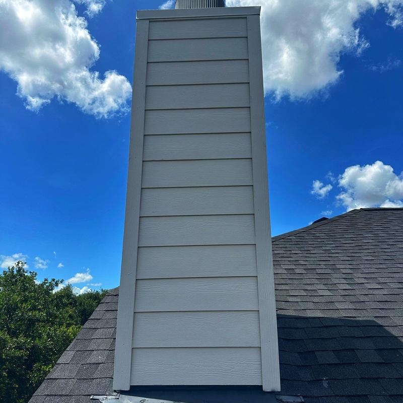 Chimney siding installation on shingle roof Chimney siding installation on shingle roof