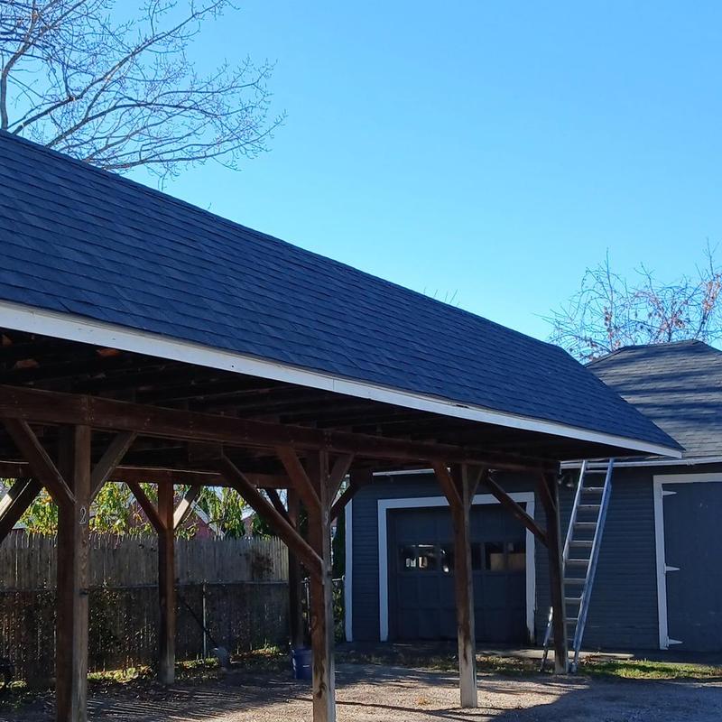 Carport roofing with new shingles and trim