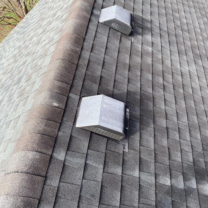Asphalt shingles with vent pipe flashing and hail damage