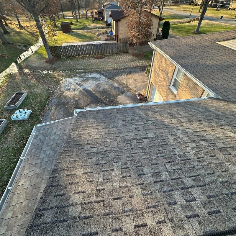 Asphalt shingle roof inspection showing hail damage