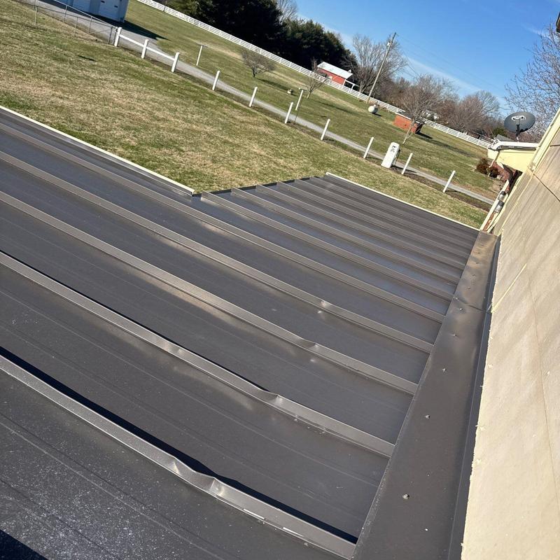 Metal roof panels with hail dents and damage