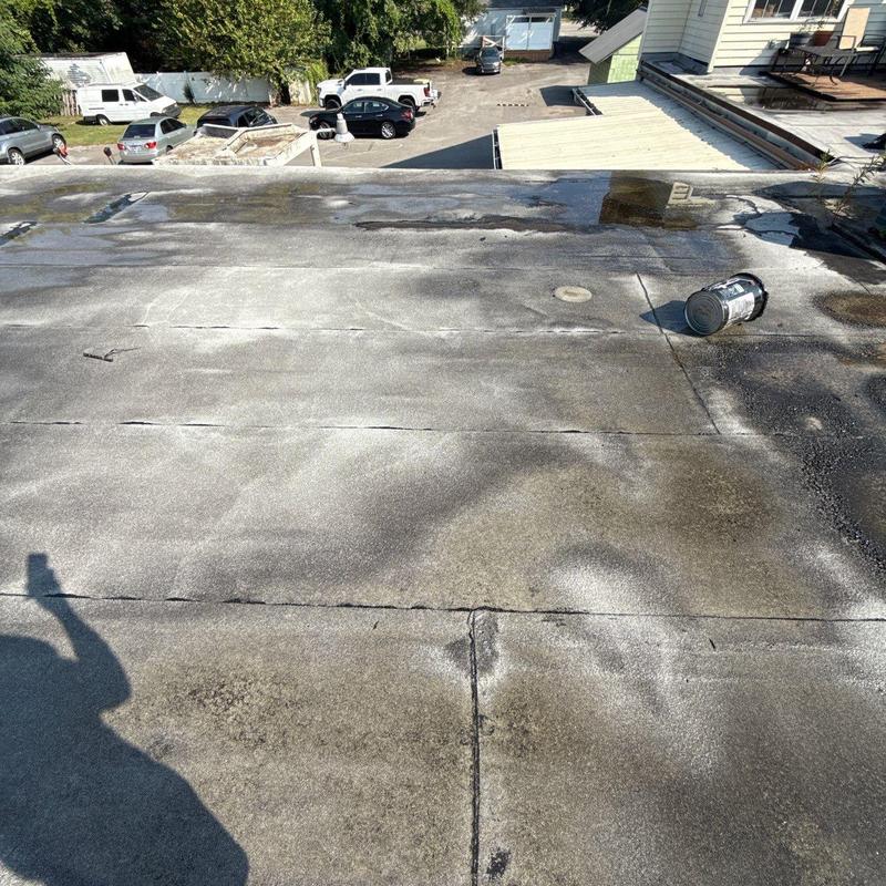 Flat modified bitumen roof with drainage and flashing issues