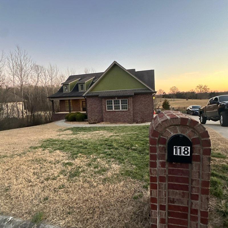 Shingle roof with hail damage and ridge impact