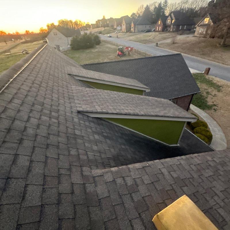 Asphalt shingle roof with ridge and ventilation details