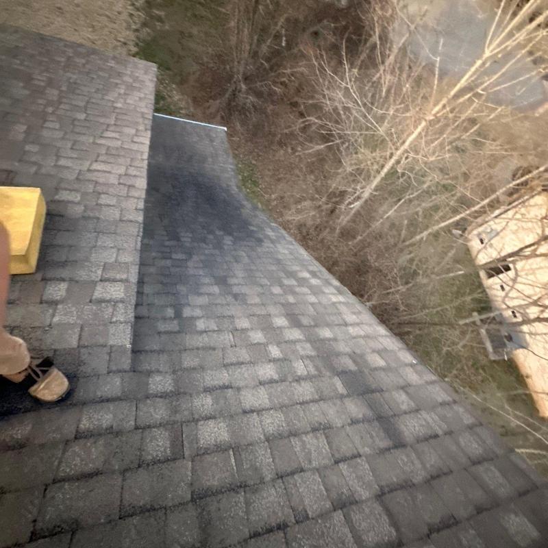 Roof shingles with hail damage and ridge inspection