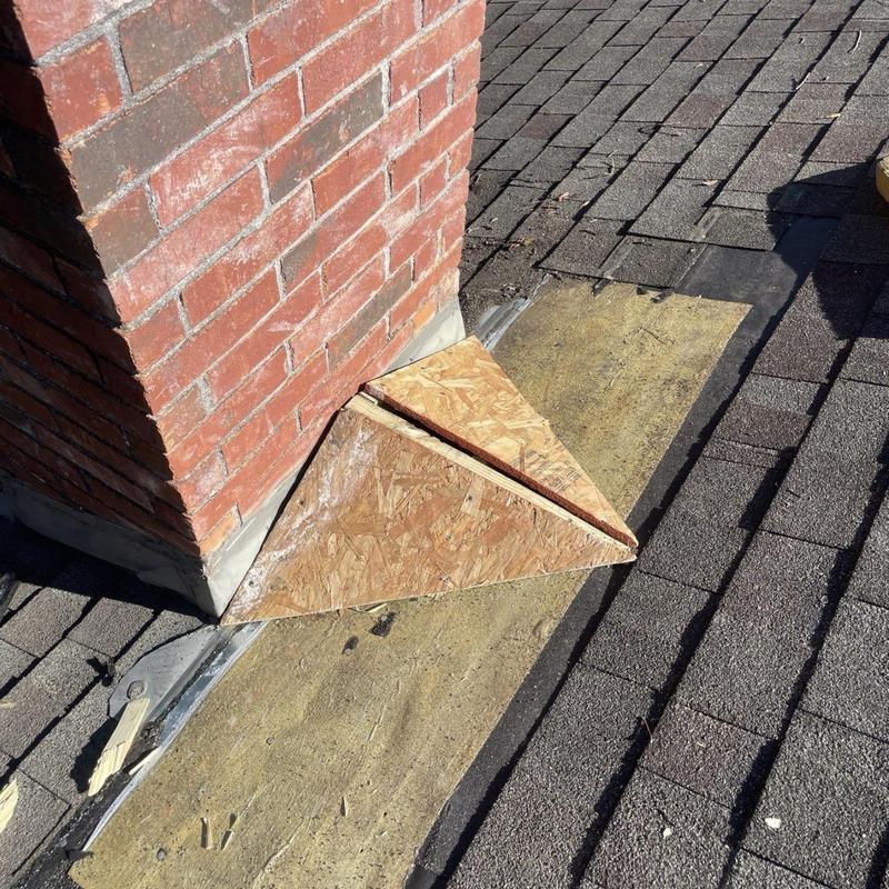 Chimney flashing repair with plywood and asphalt shingles