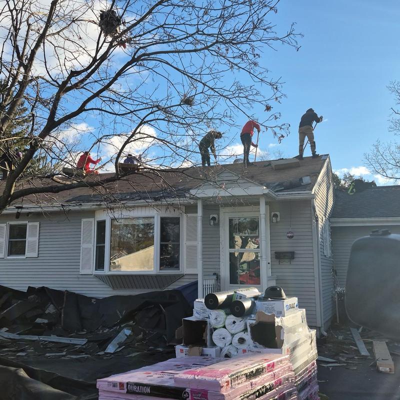 Roof decking replacement with crew working on residential home