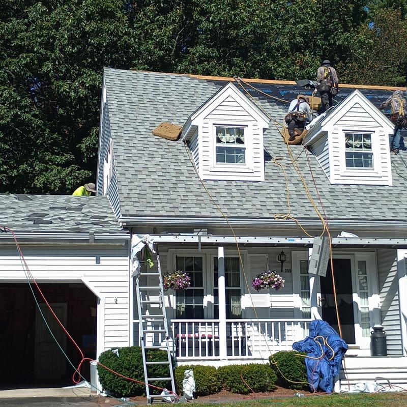 Owens Corning shingle roof installation with workers