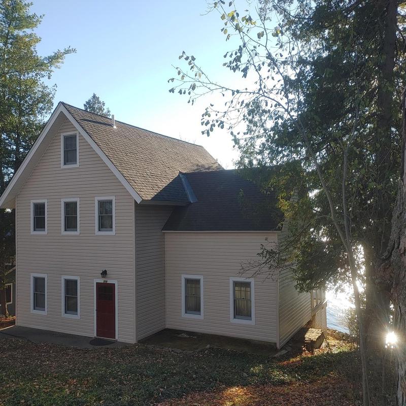 Asphalt shingle roof on beige Ferrisburgh home