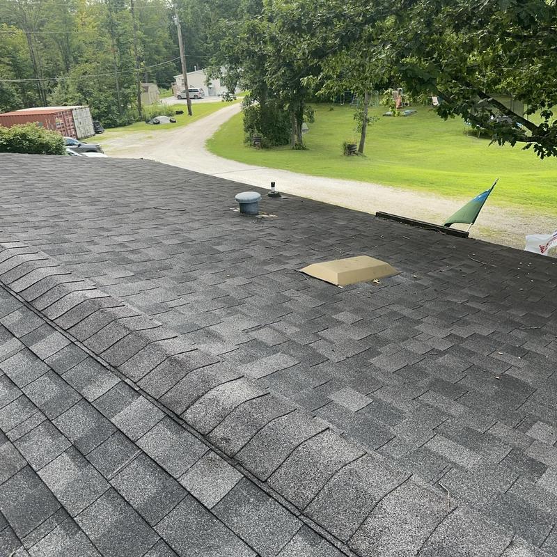 Asphalt shingle roof with vents on residential home