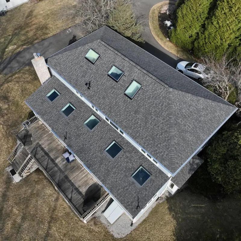 Asphalt shingle roof with skylights on residential home