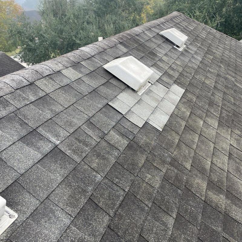 Architectural shingles with repaired skylight flashing