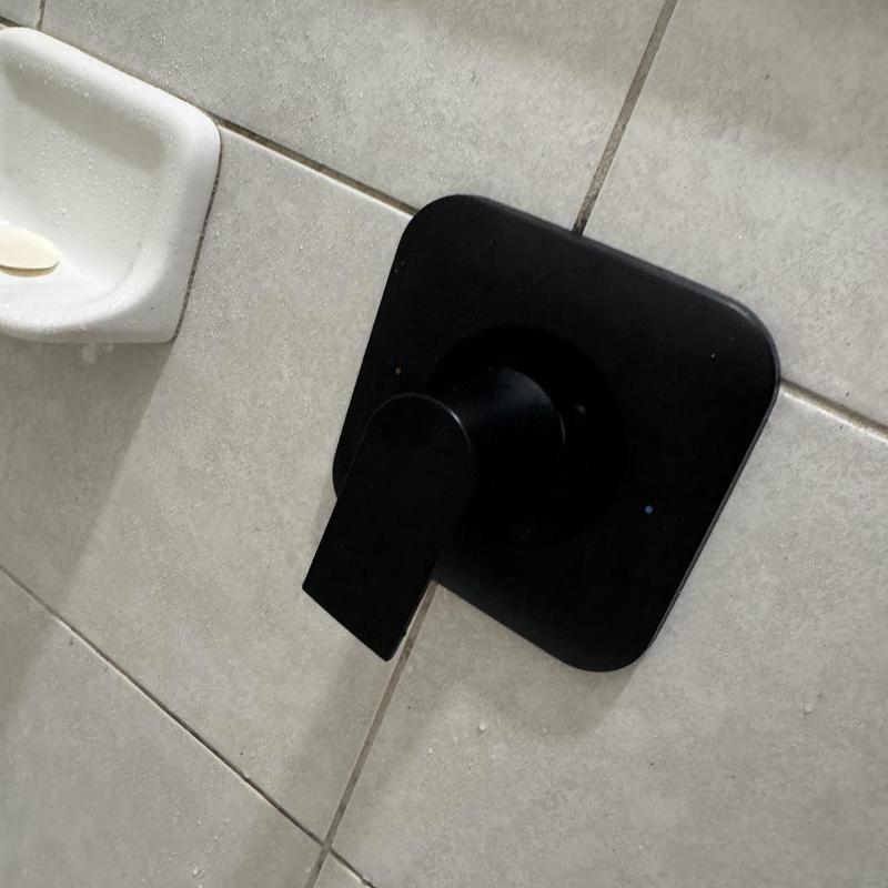 Moen shower valve handle on tiled wall