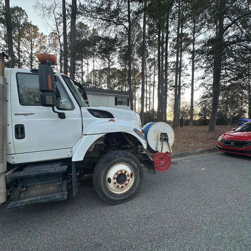 Vacuum truck front side parked on residential street Vacuum truck front side parked on residential street
