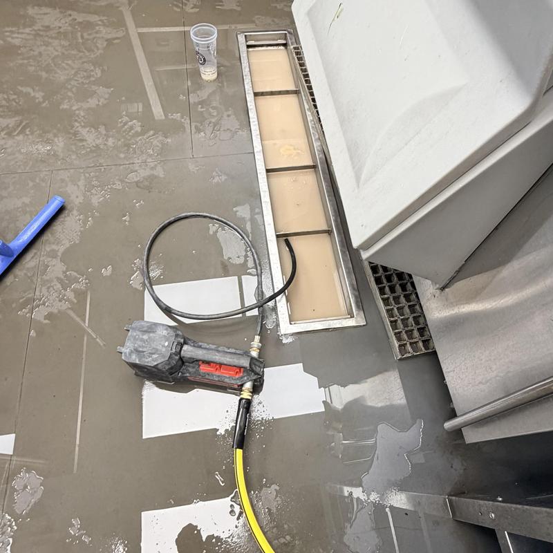 Trench drain with sewer snake clearing blockage