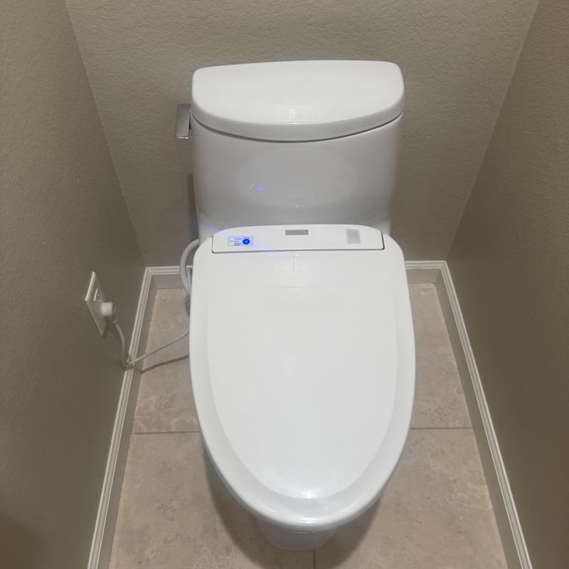 Smart toilet with fill valve adjustment in bathroom corner