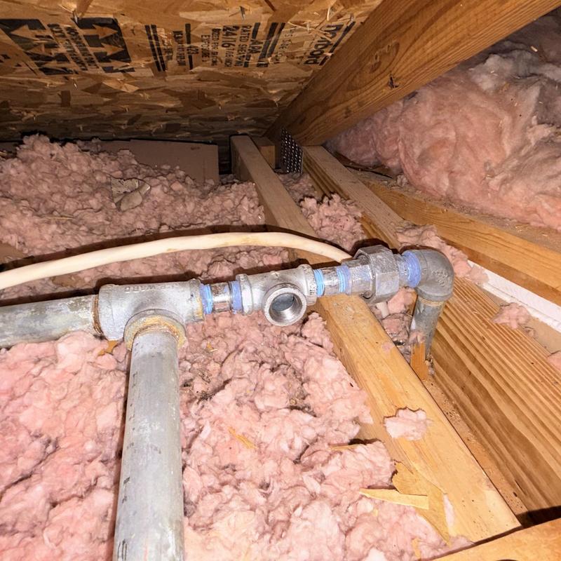 Galvanized gas line tee and union in attic eave