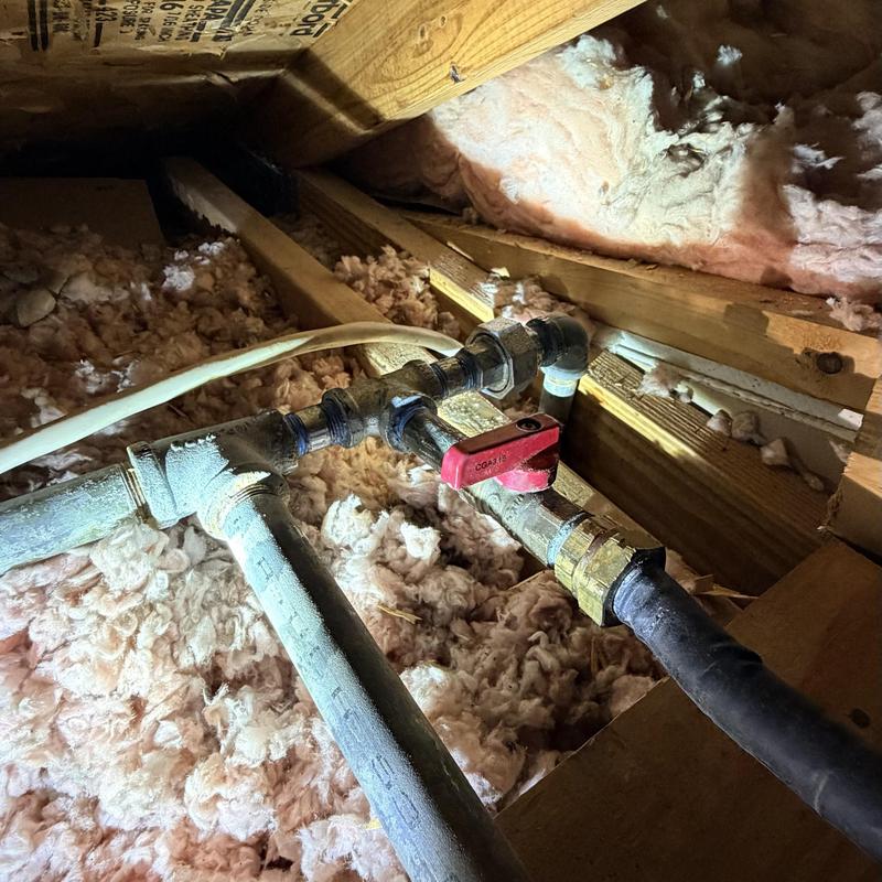 Gas line with shut-off valve installed in attic eave