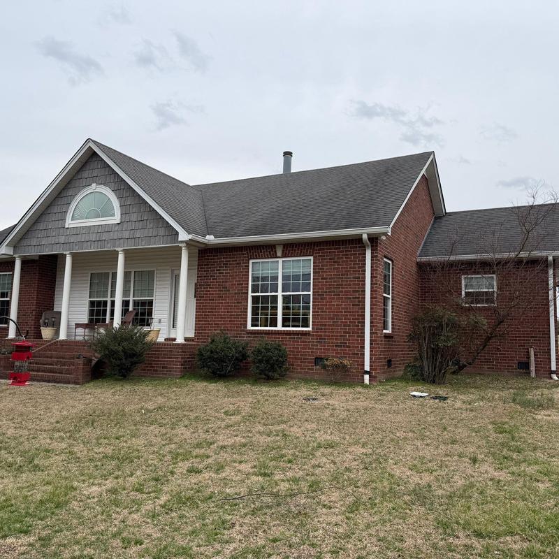 Asphalt shingle roof with hail damage inspection