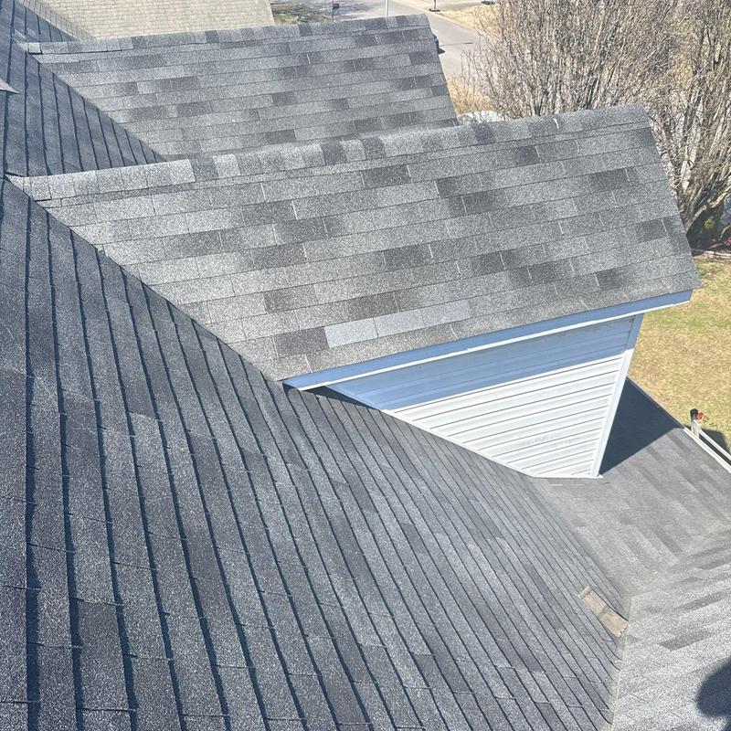 Roof shingles with hail damage and flashing areas