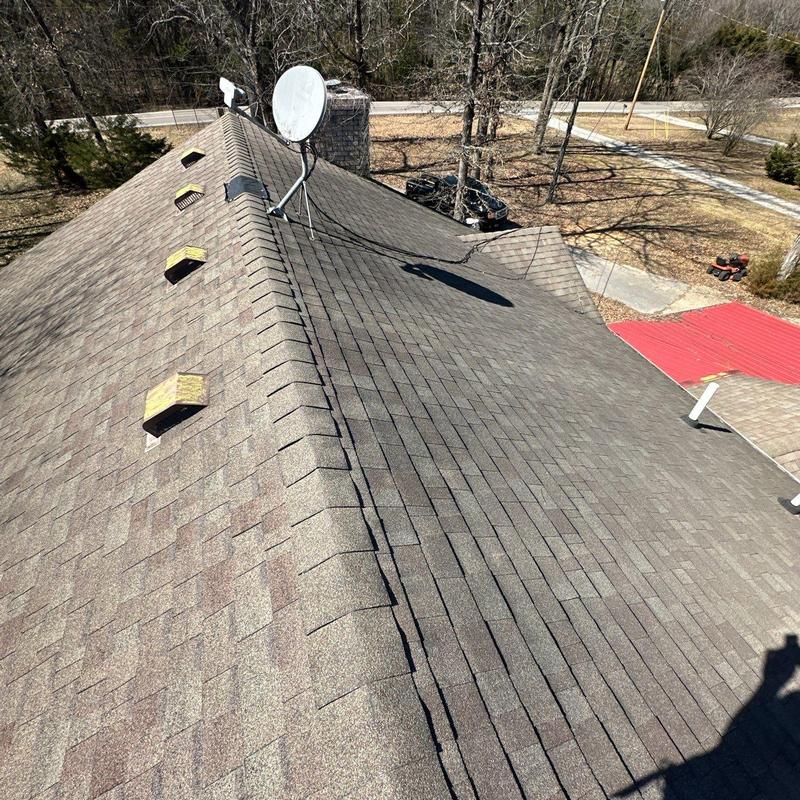 Roof ridge caps and shingles with satellite dish