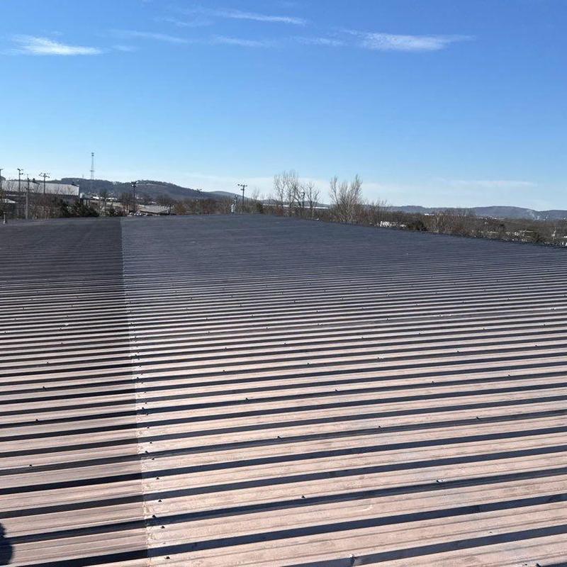 Metal commercial roof with hail damage inspection