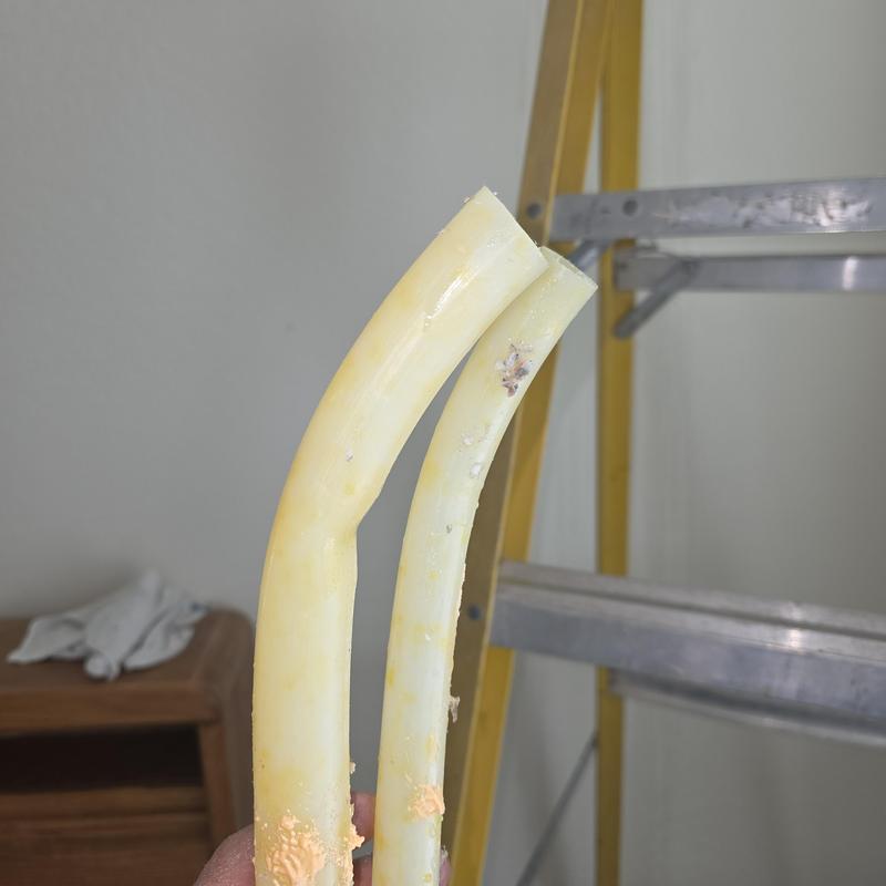 PEX water supply pipes with leak and damage close-up