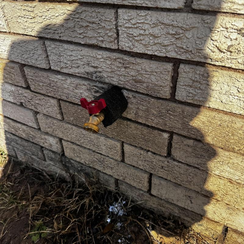 Outdoor hose bib installation on brick wall