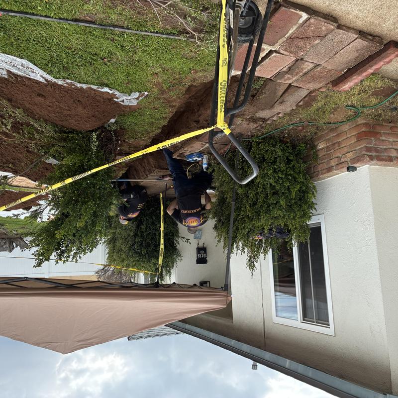 Cast iron sewer main line excavation at residential yard