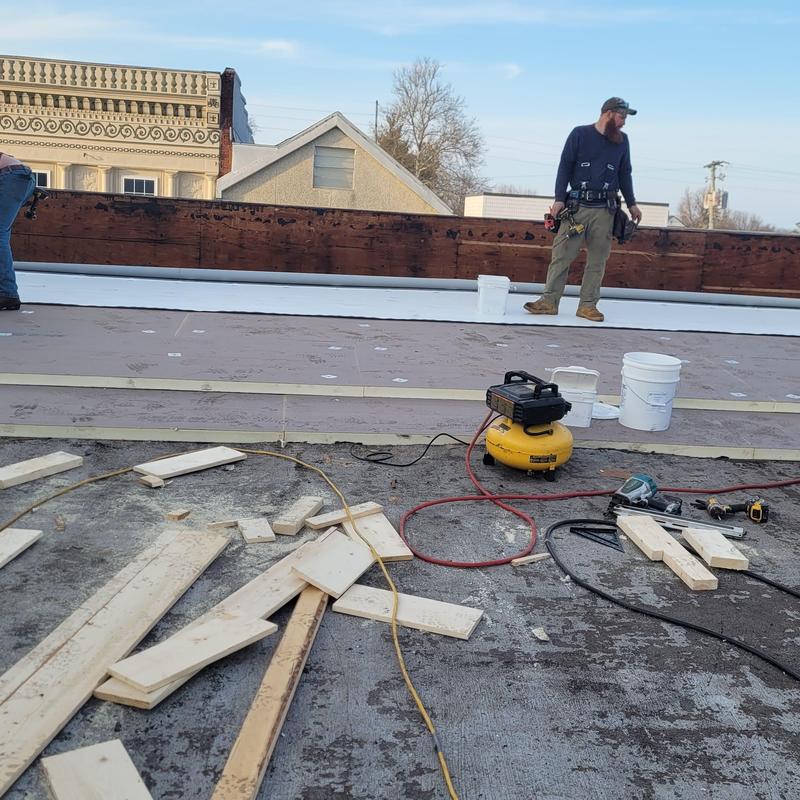 PVC single ply roofing installation on flat commercial roof