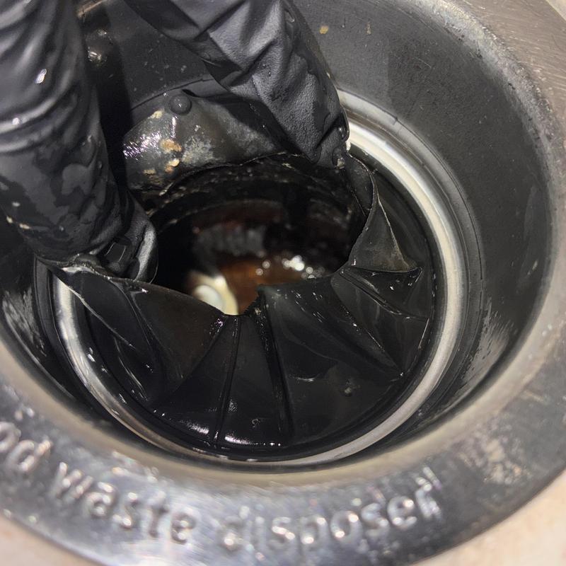 Garbage disposal drain sealing gasket install close-up