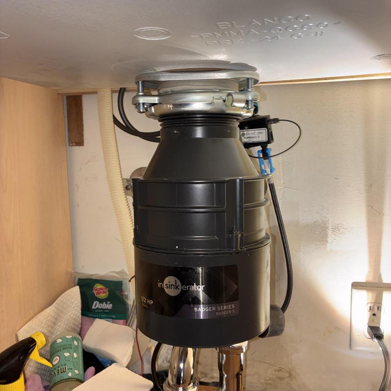 Garbage disposal unit replacement under sink