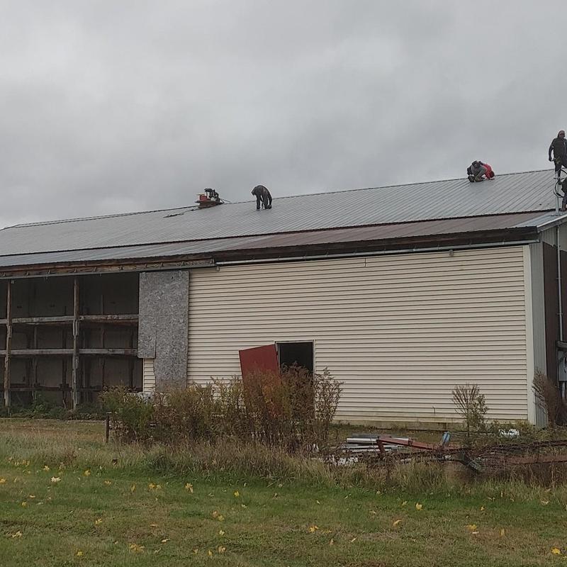 Metal roof coating with TOPPS system in Milton, VT