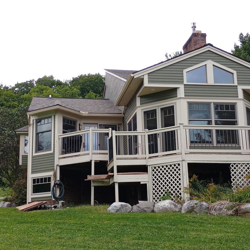 Shingle roof on large home with deck in Vermont