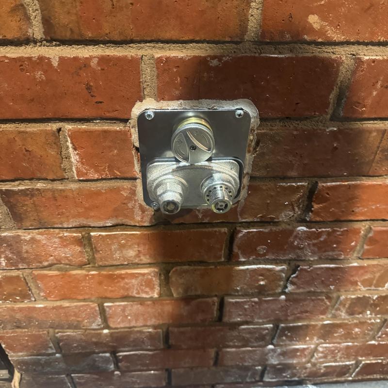 Commercial hose bib valve on brick wall in Goodyear