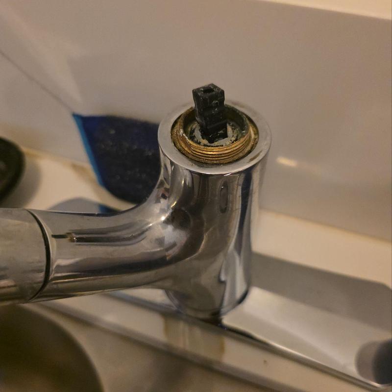 Kitchen faucet with removed handle and exposed cartridge