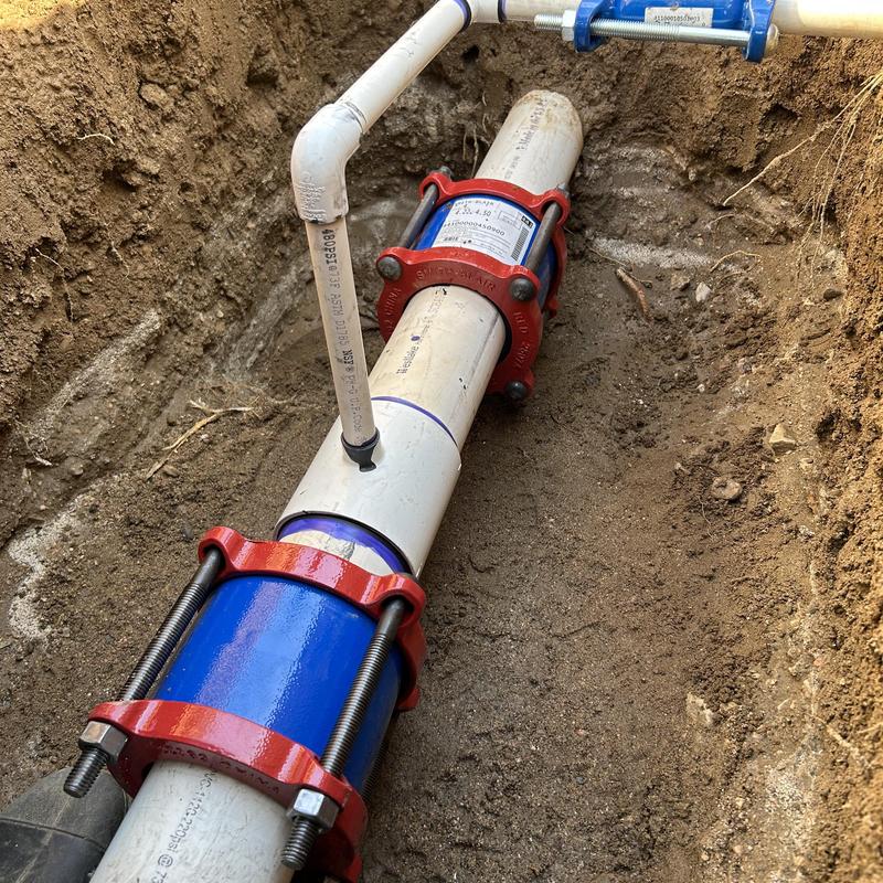 PVC water main pipe with mechanical couplings in trench