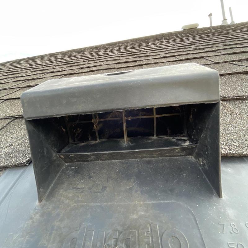 Dryer vent on shingled residential roof in League City