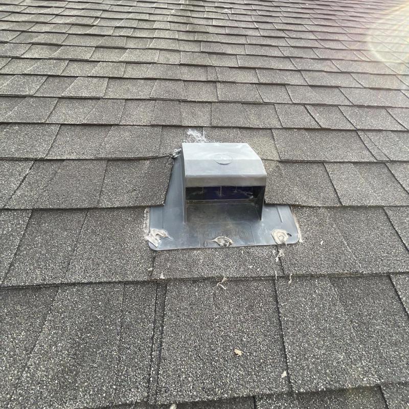 Dryer vent with flashing on asphalt shingle roof