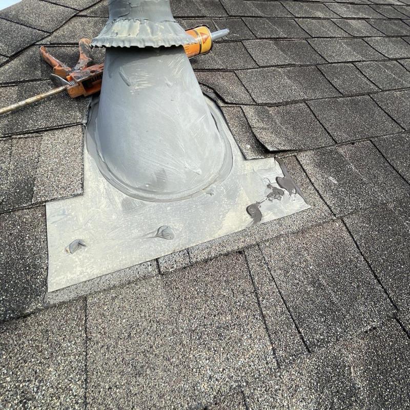 Dryer vent flashing on asphalt shingle roof installation