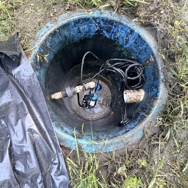 Grinder pump basin with alarm float and wiring