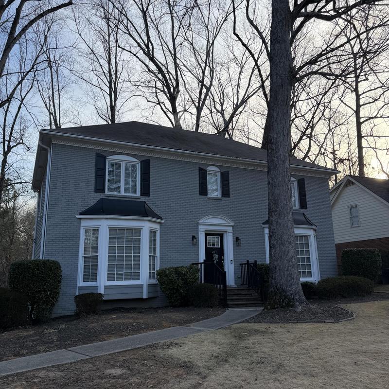 Window sill leak from improper slope at brick house