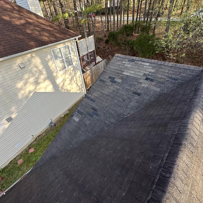 Asphalt shingle roof with severe granular loss and damage