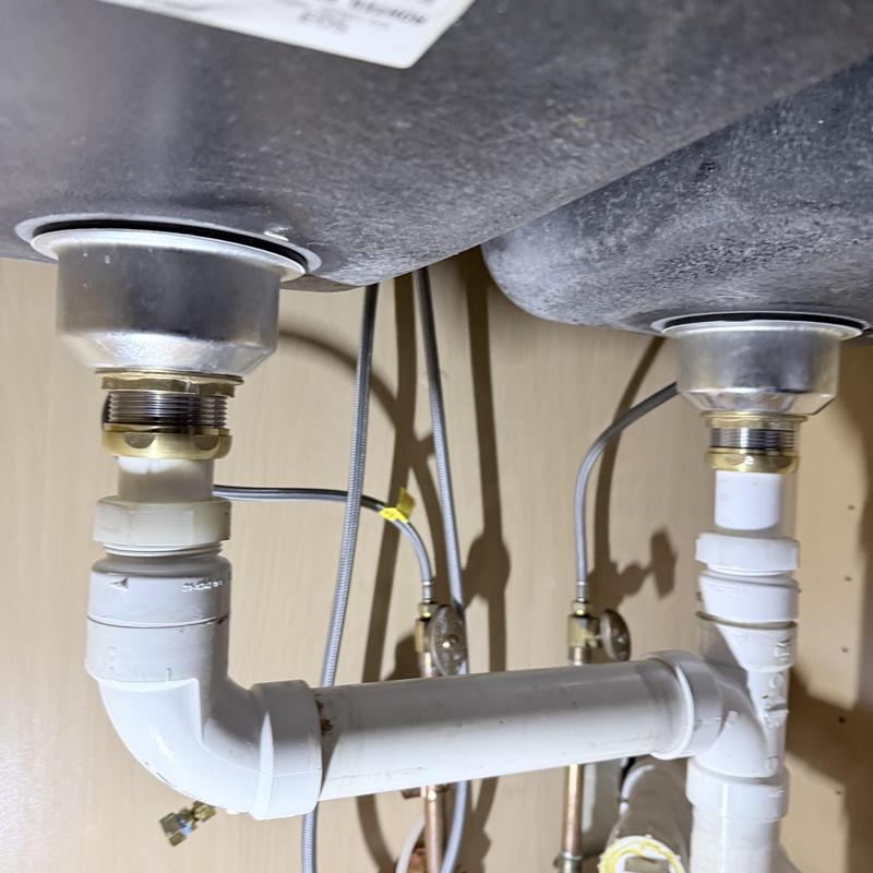 Kitchen sink drain pipes and fittings under sink Kitchen sink drain pipes and fittings under sink