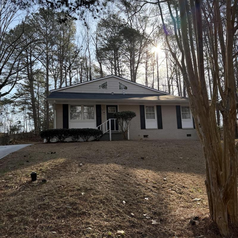 Charcoal 3-tab roof inspection on two-story house