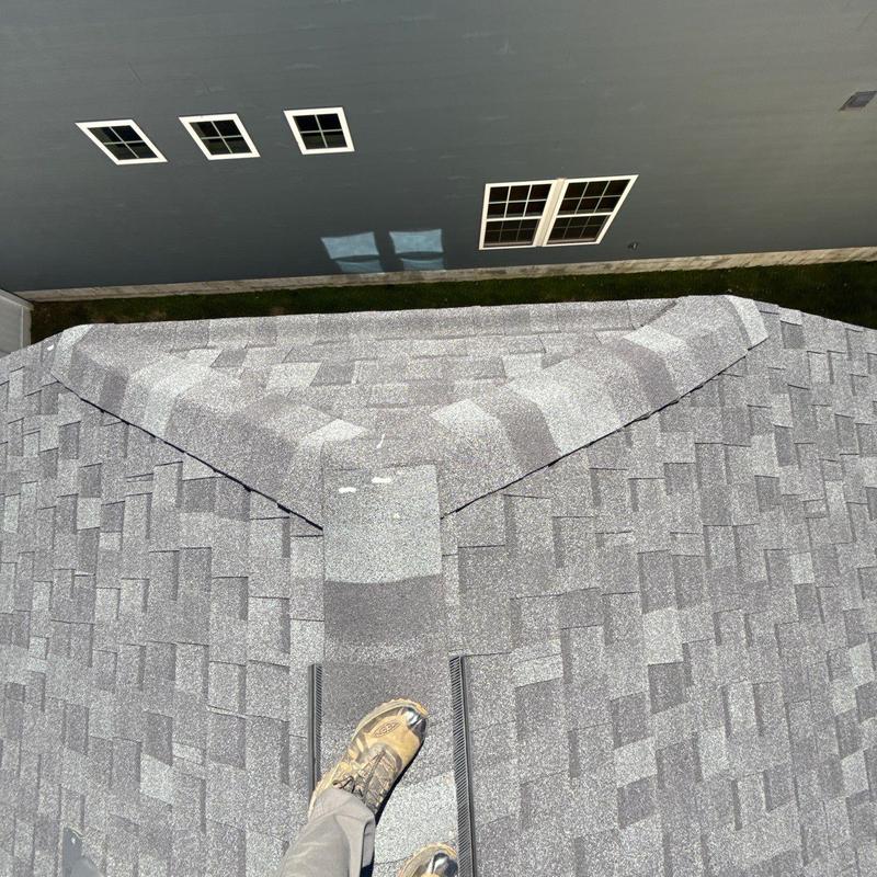 Asphalt shingle roof showing hail damage on ridge and valley