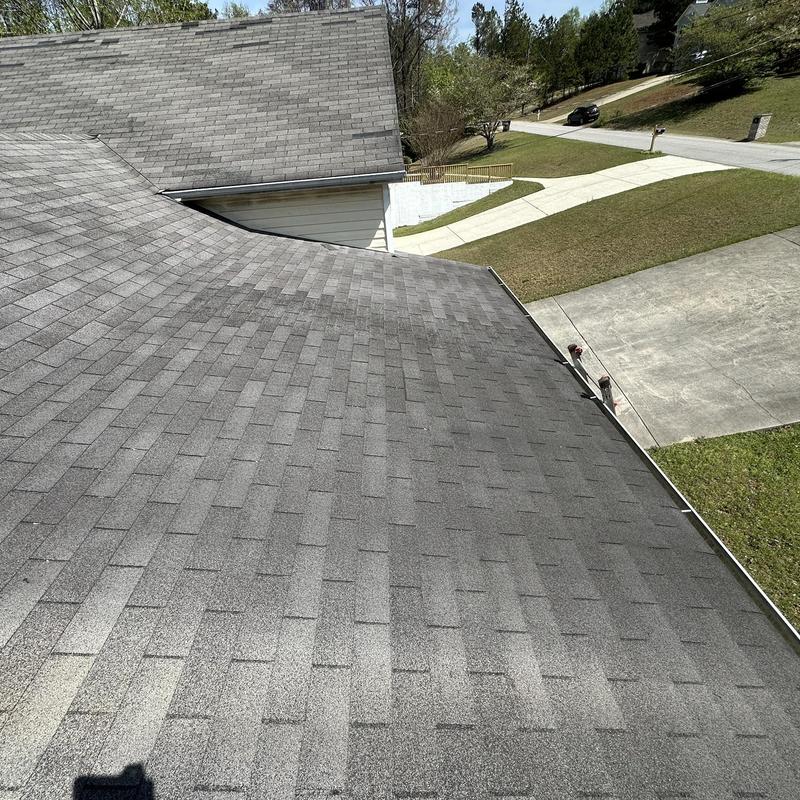 Asphalt shingle roof with wear and missing shingles