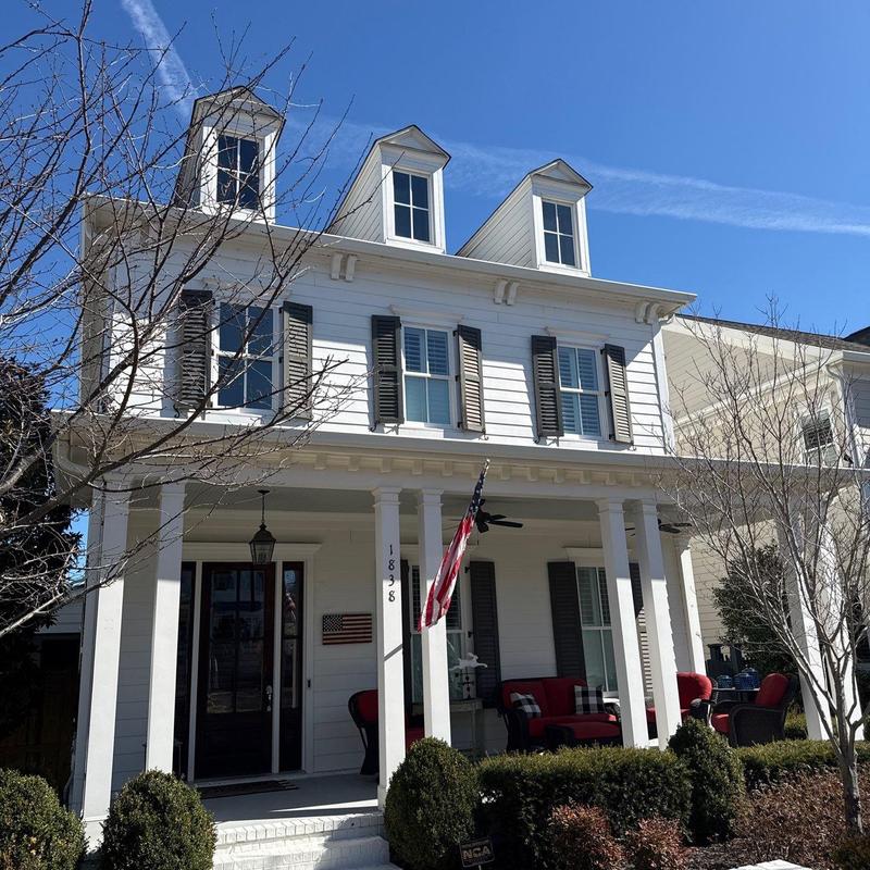 Roof shingles with hail damage inspection on house