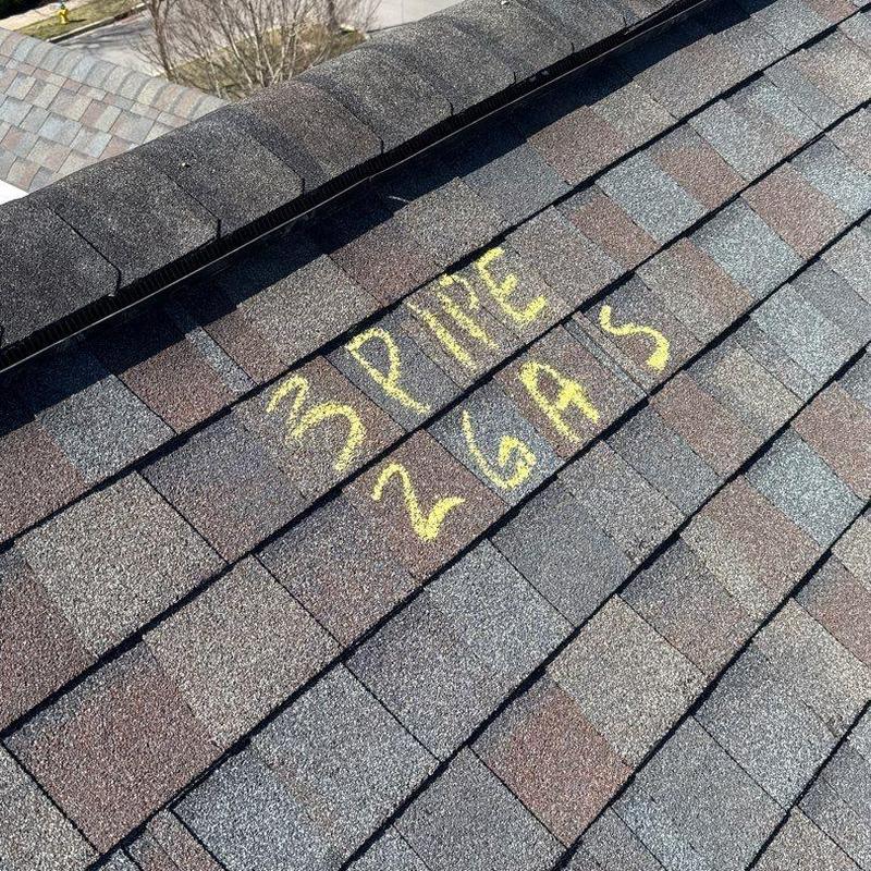 Asphalt roof shingles with marked inspection notes