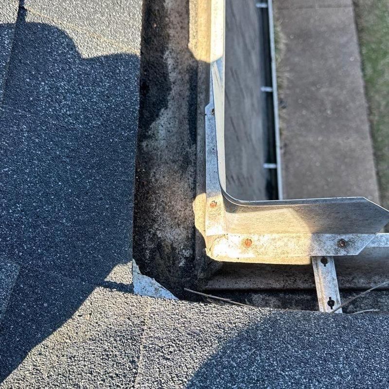 Roof flashing with hail damage and rusted fasteners